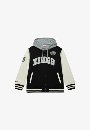 Schwarze und cremefarbene Collegejacke mit grauem Kapuzenpullover, ausgestattet mit dem Aufdruck "KINGS" in großen Buchstaben, seitlichen Taschen und gestreiften Bündchen. Kronenlogo auf der Brust.
