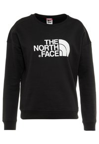 Sudadera negra de mezcla de algodón con cuello redondo, mangas largas y un logo blanco y llamativo de "THE NORTH FACE" en el frente.