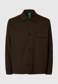 Brun jakke med knapper laget av teksturert stoff. Har spiss krage, brystlomme og svarte knapper. Grønt merke inni.