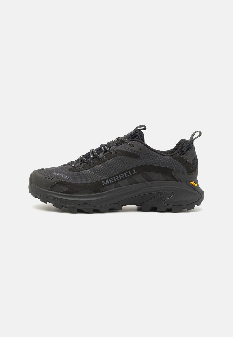 Black trail running shoes featuring a mesh upper, rugged rubber sole, and Gore-Tex support. Includes a pull tab and textured accents.