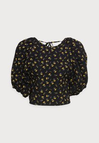 Blusa nera con maniche a sbuffo, motivo floreale in giallo e grigio, tessuto texturizzato e chiusura a fiocco sulla parte posteriore del collo.