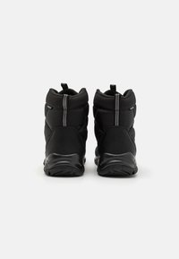 Black insulated boots with a quilted textile upper, rubber sole, and two rear pull tabs. Reinforced stitching and a high-top design.