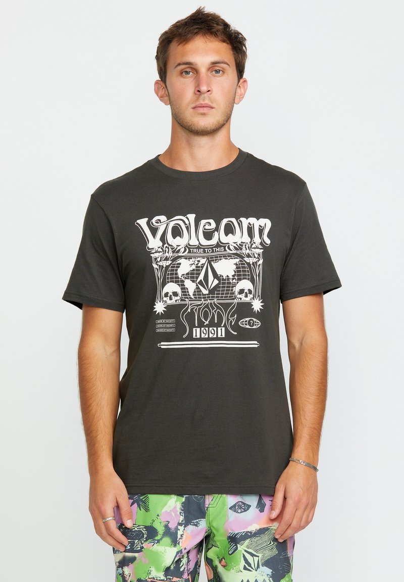 T-shirt en coton noir avec imprimé graphique blanc représentant des skulls et un globe. Encolure ronde et manches courtes ; coupe décontractée.
