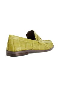 Green leather shoe with crocodile pattern, slip-on design, flat brown sole, and stitched detailing along the edges.