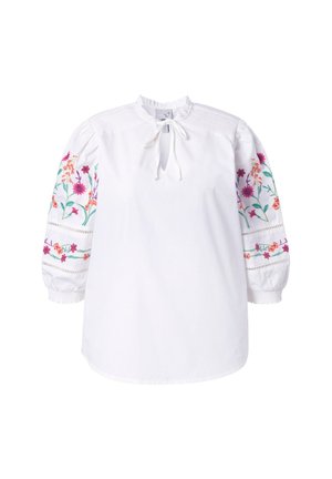 Weiße Bluse mit langen Ärmeln, bunter Blumenstickerei auf den Ärmeln, gerafften Schulterdetails und einem gebundenen Schlüsselloch-Ausschnitt.