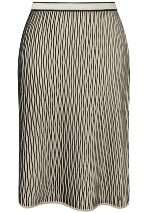 Strickrock in cremefarbenem Grundton mit schwarzen vertikalen Streifen, elastischem Taillenbund und einer leichten Kurve am Saum. Goldfarbener Akzentanhänger am unteren Rand.