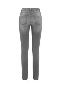 Jeans skinny grigi in denim. Design a vita alta con cinque tasche e una trama liscia. Dettaglio di cuciture lungo i bordi.