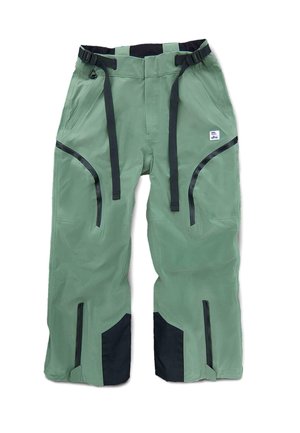 Pantalons imperméables verts avec accents noirs, taille ajustable, zips latéraux et tissu renforcé pour durabilité et fonctionnalité.