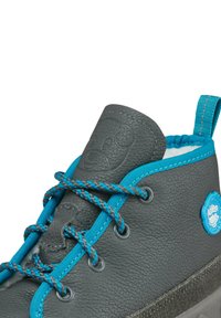Gray leather high-top shoe with blue accents, textured surface, contrasting laces, and a rounded toe; features a logo on the side.