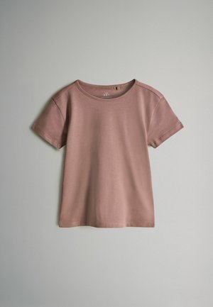 Mauve T-Shirt mit kurzen Ärmeln aus weicher Baumwolle. Verfügt über einen Rundhalsausschnitt, eine leicht taillierte Passform und saubere Nähte entlang des Saums und der Ärmel.