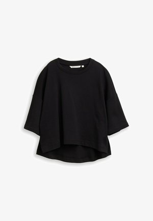 Must kandiline lühike t-särk, mis on valmistatud pehmest kangast, ringja kaelusega, lühikeste lõtvade varrukatega ja lõdva istuvusega, veidi kaardus hemiga.