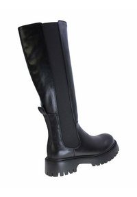 Stivali neri al ginocchio con una parte anteriore in pelle liscia e lati in tessuto elastico. Suola in gomma spessa con motivo scanalato, che garantisce trazione.