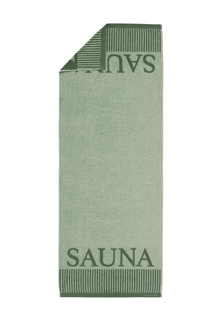 Grünes Saunatuch mit strukturierten Oberfläche, das das Wort "SAUNA" in fetter Schrift sowie ein gestreiftes Design am oberen Rand trägt. Rechteckige Form.