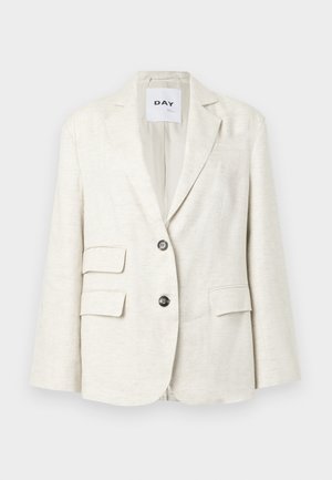 Lys beige blazer laget av teksturert stoff, med skrårevers, to frontlommer og to svarte knapper. Merket sier "DAY."