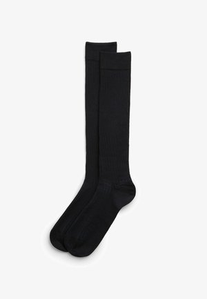 Czarne skarpetki sięgające do kolan o żeberkowanej teksturze, z wzmocnionymi palcami i bezszwowym wzornictwem zapewniającym komfort i trwałość.