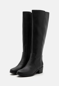 Black knee-high leather boots with a smooth texture, square toe, low block heel, and elastic side panels for easy wear.