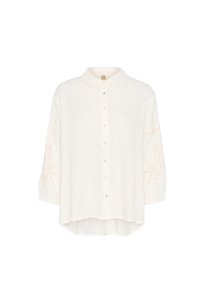 White button-up shirt with a collar, featuring long sleeves and embroidered patterns in light beige on the sleeves. Soft, textured fabric.