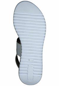 Semelle de sandale en caoutchouc blanc avec un motif de grip texturé, comprend un numéro 37 estampillé et le logo de la marque. Présente un design minimaliste et des lignes épurées.