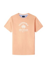 Camiseta de manga corta en tejido naranja pálido con cuello redondo. Presenta texto impreso en blanco y un gráfico de palmera. Corte regular.