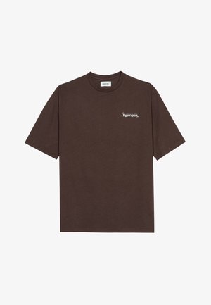 Brown cotton t-shirt with short sleeves, round neckline, and white printed text "Hyperspace" on the left chest and star accents.