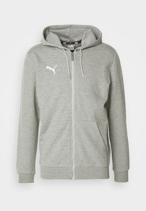 Sweatshirt cinzento com fecho éclair, feito de um tecido suave, com bolso canguru e punhos canelados. O logo branco no lado esquerdo do peito acrescenta detalhe.