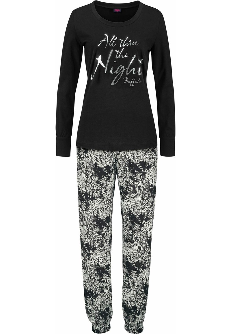 Black long-sleeve top with silver text "All thru the Night," paired with loose-fitting floral print pants in black and white.