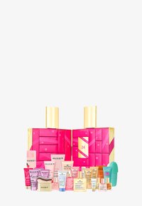 NUXE advent calendar with pink and gold packaging, featuring 24 compartments and assorted skincare products in various tube sizes and colors.