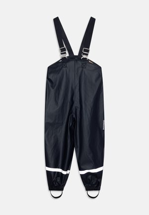Marineblauwe waterdichte overalls met verstelbare banden, reflecterende witte strepen aan de onderkant en elastische manchetten voor een veilige pasvorm.