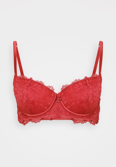 Red lace bra with underwire, padded cups, and decorative lace trim along the edges. Adjustable straps and a front clasp detail.