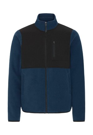 Mėlyna flisinė striukė su juodu viršutiniu paneliu, užtrauktuku priekyje ir krūtinės kišene. Pasižymi šoninėmis kišenėmis ir elastingais rankogaliais, užtikrinančiais tvirtą prigludimą.