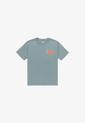 Light blue short-sleeve t-shirt made of cotton. Features a small orange floral graphic on the left chest and a round crew neckline.