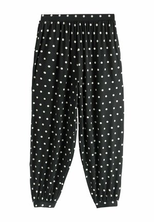 Mustad lahtised püksid valgete täppidega, elastse vöökohaga, küljetaskutega ja säärte all elastsete mansettidega.