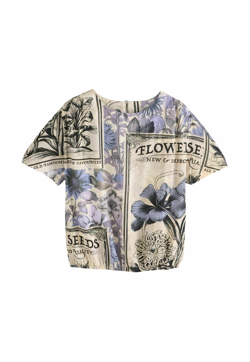 Short-sleeve top featuring floral print in shades of blue and purple on a light background, with text motifs and a relaxed fit.