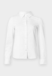 Λευκό πουκάμισο με μακριά μανίκια, κούμπωμα με κουμπιά στο μπροστινό μέρος, γιακά και μανσέτες. Κατασκευασμένο από λείο ύφασμα χωρίς εμφανή σχέδια ή διακοσμήσεις.