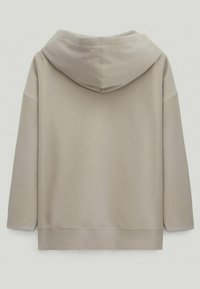 Beige oversized hoodie with long sleeves and a large hood, shown from the back on a plain background.