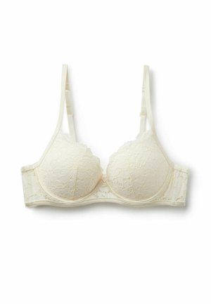 Krémově zbarvená krajková podprsenka s kosticemi a nastavitelnými ramínky, zobrazená natažená na bílém pozadí.