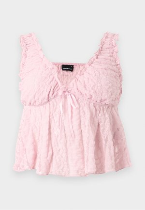 Ανοιχτό ροζ cropped top από δαντέλα με βολάν στα τιράντες, V-λαιμόκοψη και μικρό φιόγκο μπροστά στο κέντρο.