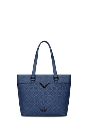 Blue quilted tote bag with two long handles, featuring a V-shaped accent and logo. Made of textured material, structured design.