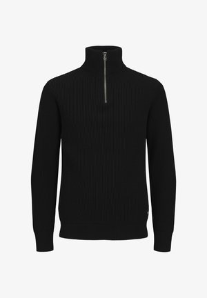 Juodas megztinis su briaunota tekstūra, aukštu kaklu ir pusiau užtrauktuku. Ilgos rankovės su prigludusiais rankogaliais ir tiesiu hemu apačioje.