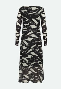 Schwarz-weißer Langarmkleid mit abstraktem Muster, semi-transparentem Stoff, tailliertem Schnitt, fließendem Rock und rundem Ausschnitt.