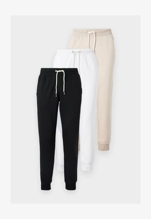 Tre paia di pantaloni della tuta nei colori nero, bianco e beige. Ogni paio è dotato di vita elastica, coulisse e polsini alle caviglie.