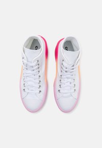 White high-top canvas sneakers with white laces and gradient soles transitioning from pink to orange to red, viewed from above.