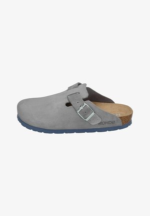 Gray suede clog with a low profile, single adjustable buckle, and a cork footbed. Blue rubber sole provides contrast and traction.