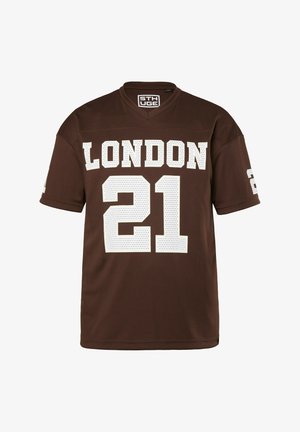 Ruskea urheilupaita, jossa on valkoiset "LONDON"-tekstit ja numero "21" edessä, lyhyet hihat ja V-pääntie.