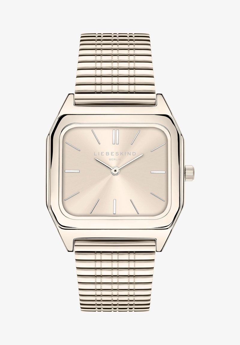 Vierkante goudkleurige horloge met een geborstelde beige wijzerplaat, zilveren uurmarkeringen en een gestructureerde mesh armband. Heeft een kroon aan de zijkant.