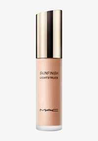 MAC Skinfinish Lightstruck nestemäinen korostustuote, jossa on kultareflektiivinen korkki valkoista taustaa vasten.