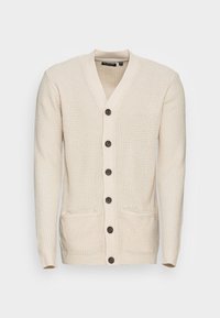 Krémový pletený kardigan s vaflovou strukturou, výstřihem do V, šesti tmavými knoflíky, dlouhými rukávy a dvěma předními kapsami.