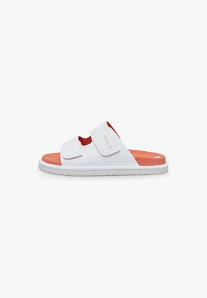 White slide sandals with two adjustable Velcro straps, a red interior, and orange insole. The sole is textured for grip.