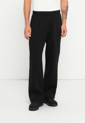 LOOSE PANTS - Verryttelyhousut - black