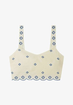 Crop top beige chiaro con motivi geometrici blu, orlo a scallop e spalline sottili con dettagli coordinati lungo i bordi.